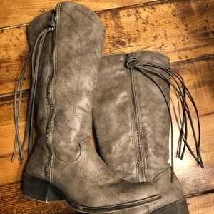 Tall fringe western style boots